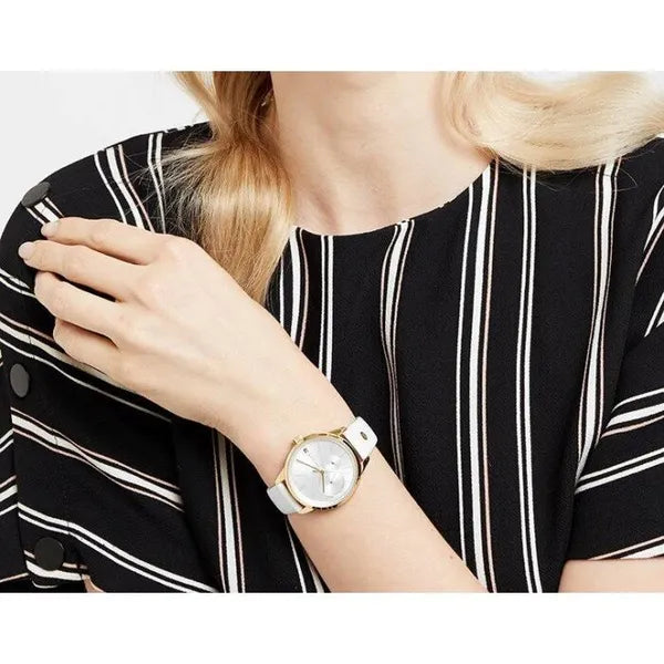 Tommy Hilfiger 1782018 női karóra, arany tok, fehér bőrszíj, ezüst számlap