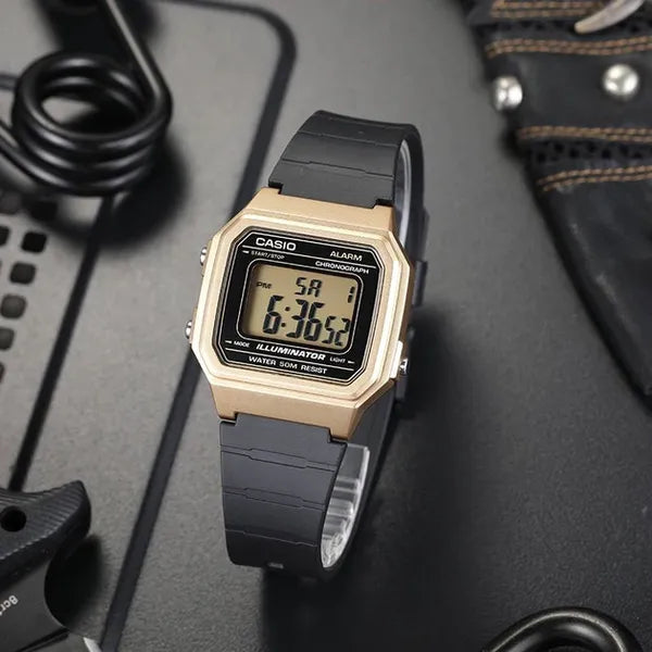 Casio W-217HM-9A uniszex digitális karóra, arany tok, fekete szíj, WR50, doboz
